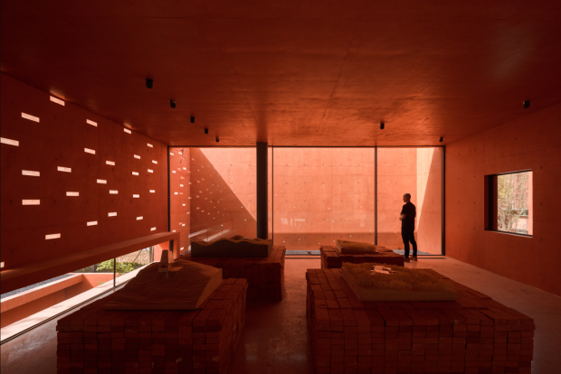 Mix Architecture's Red Box Exhibition Center, A Majestic Monolith Carved from Complete Stone