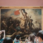 Two Activists Detained for Placing Posters Around "Liberty Leading The People" Painting at Louvre